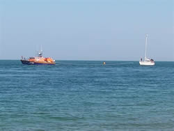 De Bizjaak being towed by Voluntary Worker