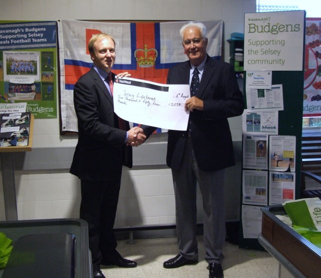 Noel Kavanagh presenting John Light, Branch Chairman, with the cheque