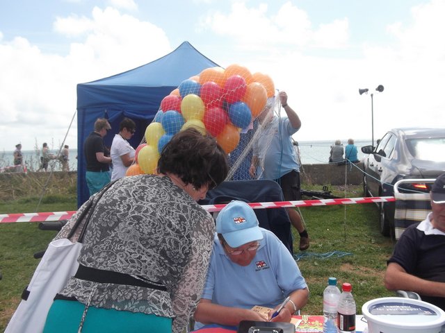 Jean Light selling raffle tickets for the bike on Launch Day